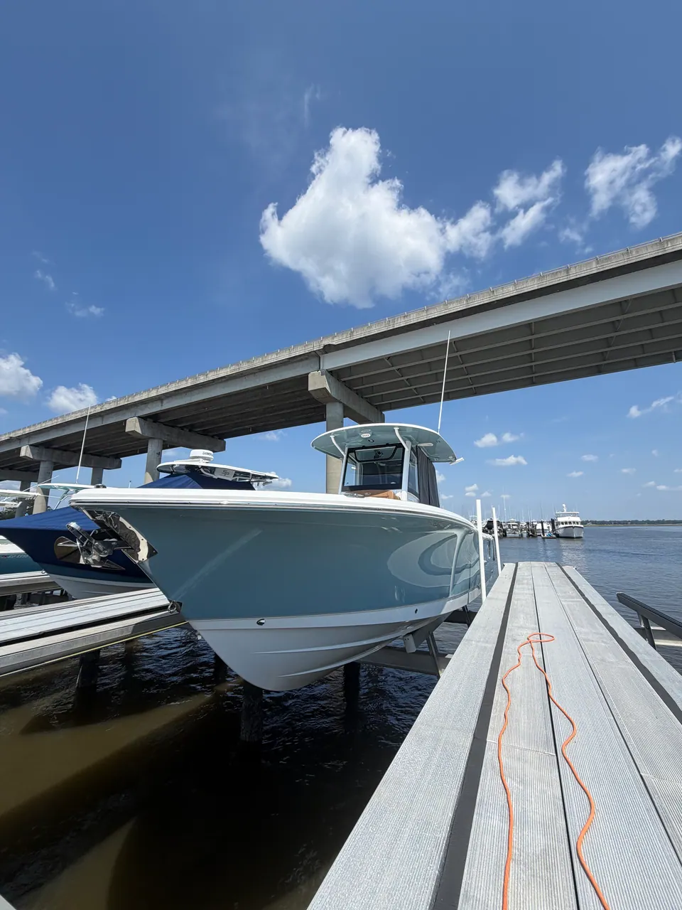 Light blue center console on a lift beside a bridge
