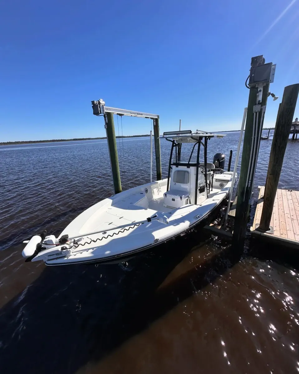 Center console on a lift beside open water