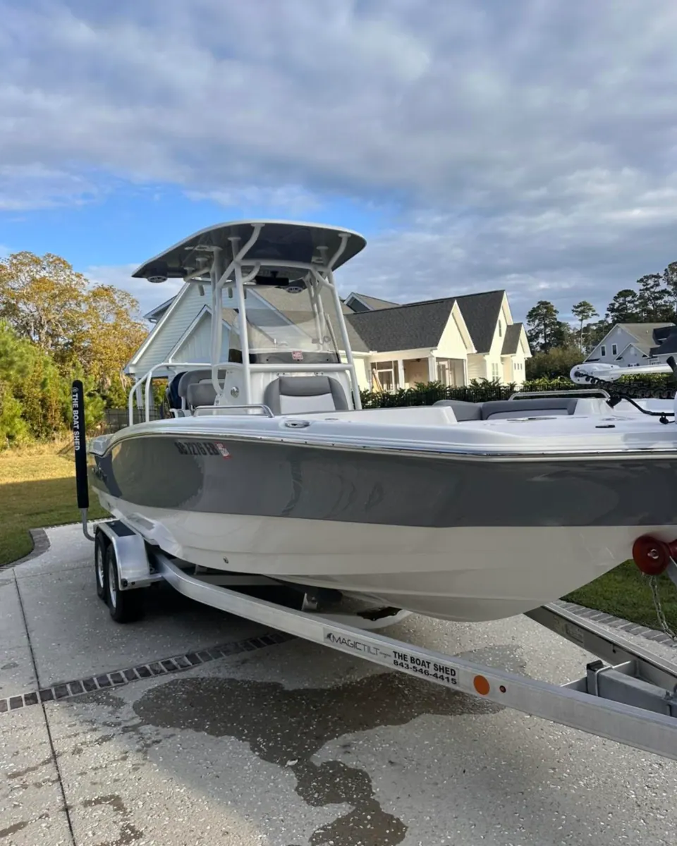Gray and white center console on a trailer in a driveway